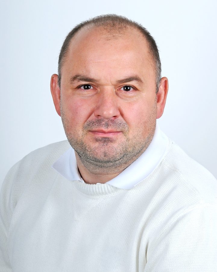 Portrait of Aljosa Krupenko, author of Casino Secrets, wearing a white sweater